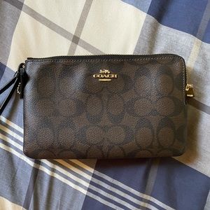 Coach Clutch in Signature Canvas